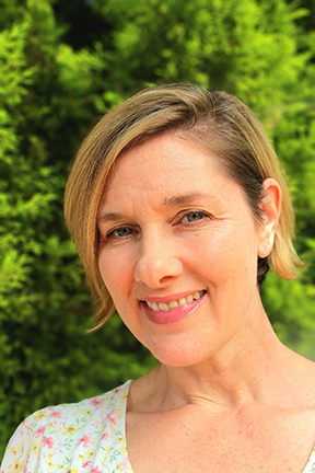 Lauren smiling outdoors